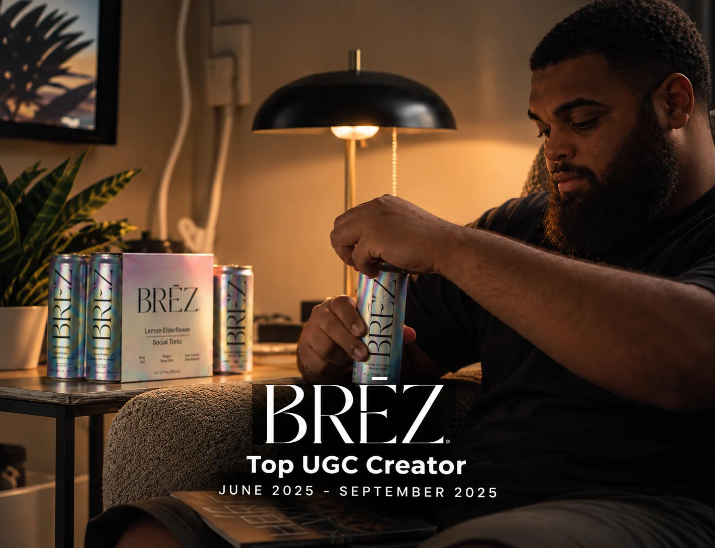 Lifestyle UGC photography for BREZ, a wellness beverage brand, creator opening a can in warm lamplight