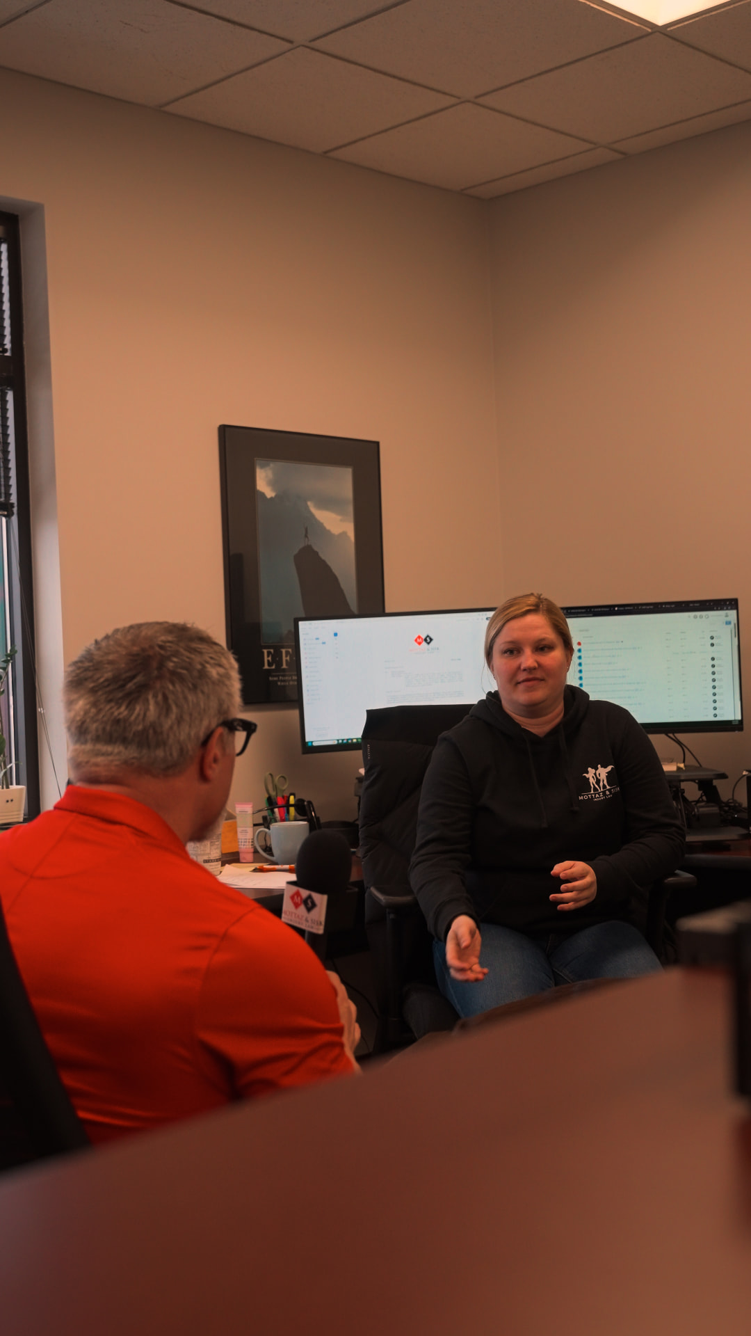 Team member interviewed on camera inside the Mottaz & Sisk office